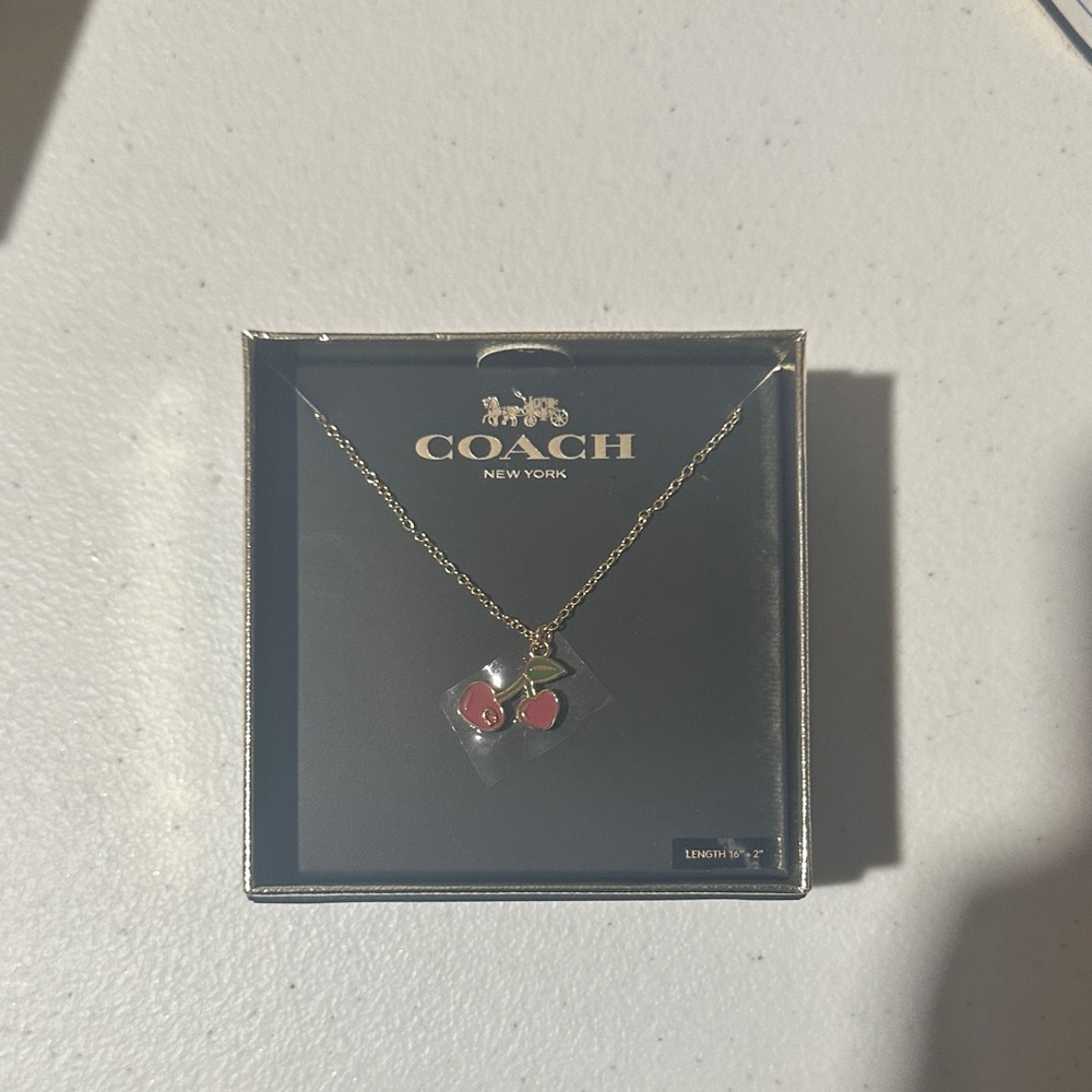 Coach Gold-Tone Cherry Pendant Necklace with Red Accents